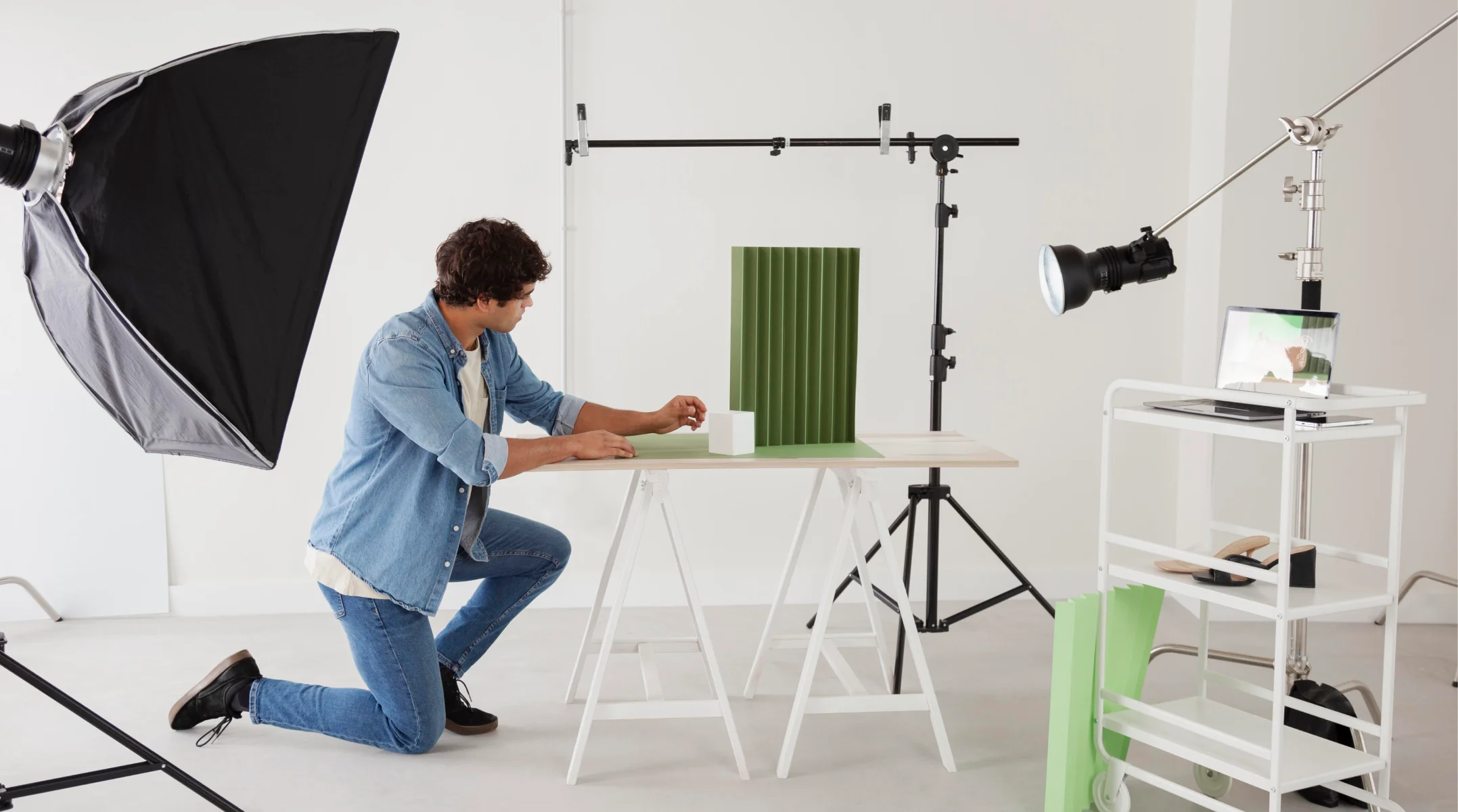 a person setting up for 360 product photography in a studio
