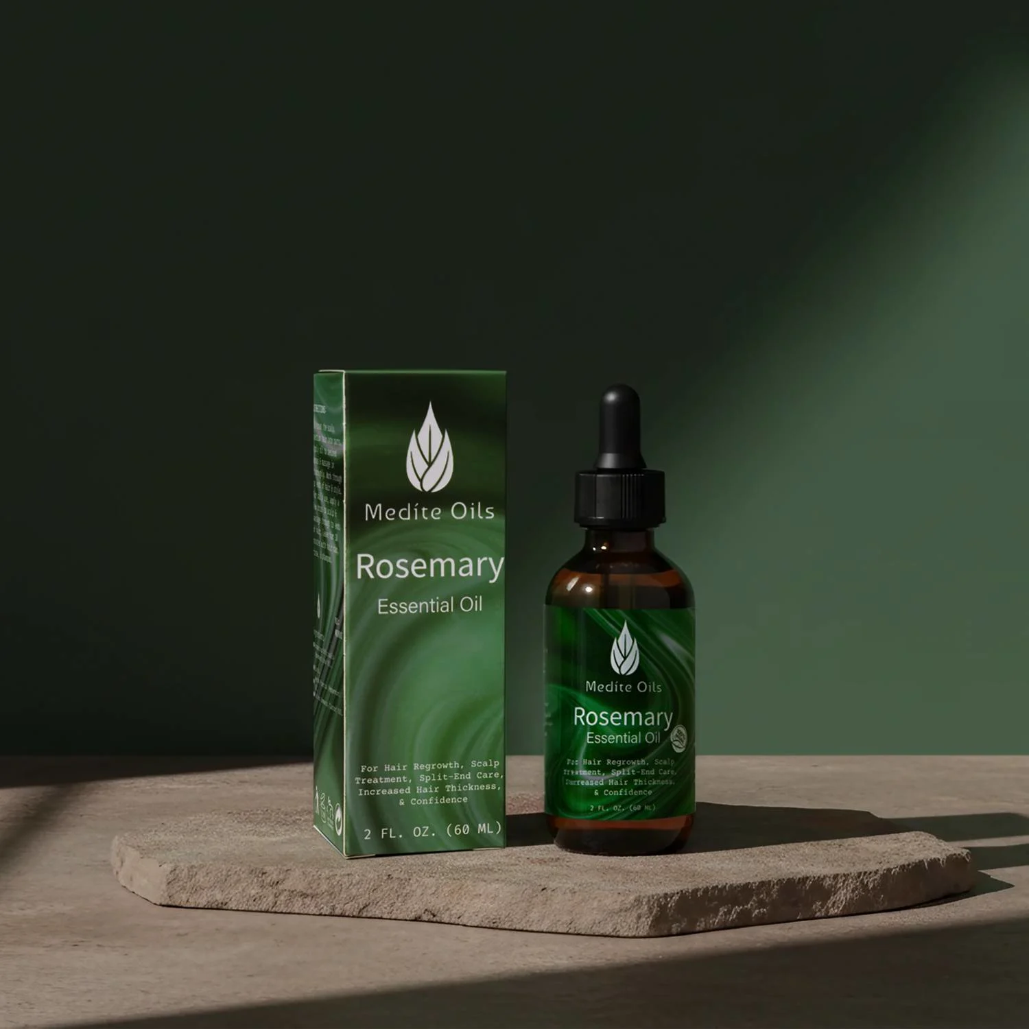 studio shot of rosemary essential oil