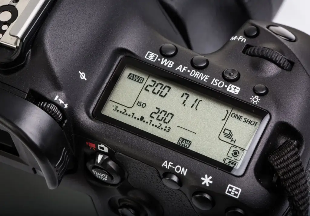 Close-up of a DSLR top LCD showing settings